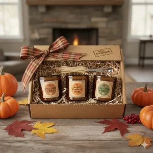 A curated fall gift set featuring apple cider and spice candles with a "Made in Canada" aesthetic.