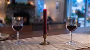 Glowing taper candles for dinner table, creating an intimate evening atmosphere.